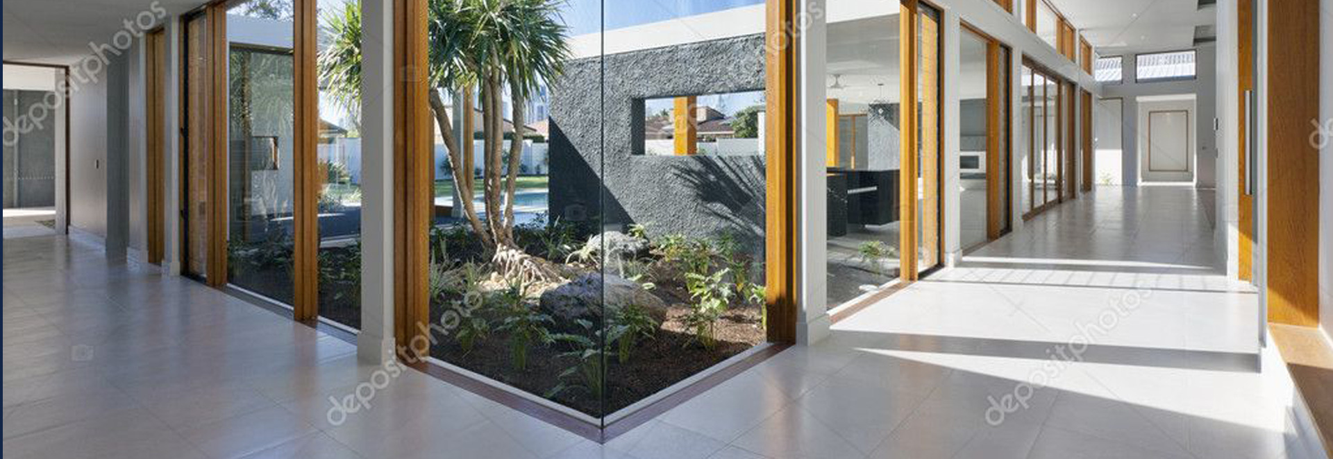 A room with plants and a glass wall